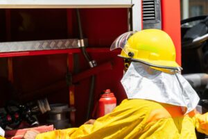 Fire fighter preparing check equipment for rescuing protection
